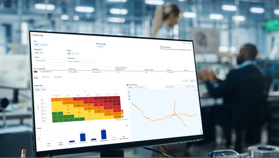 Photo of a PC screen with data and graphs