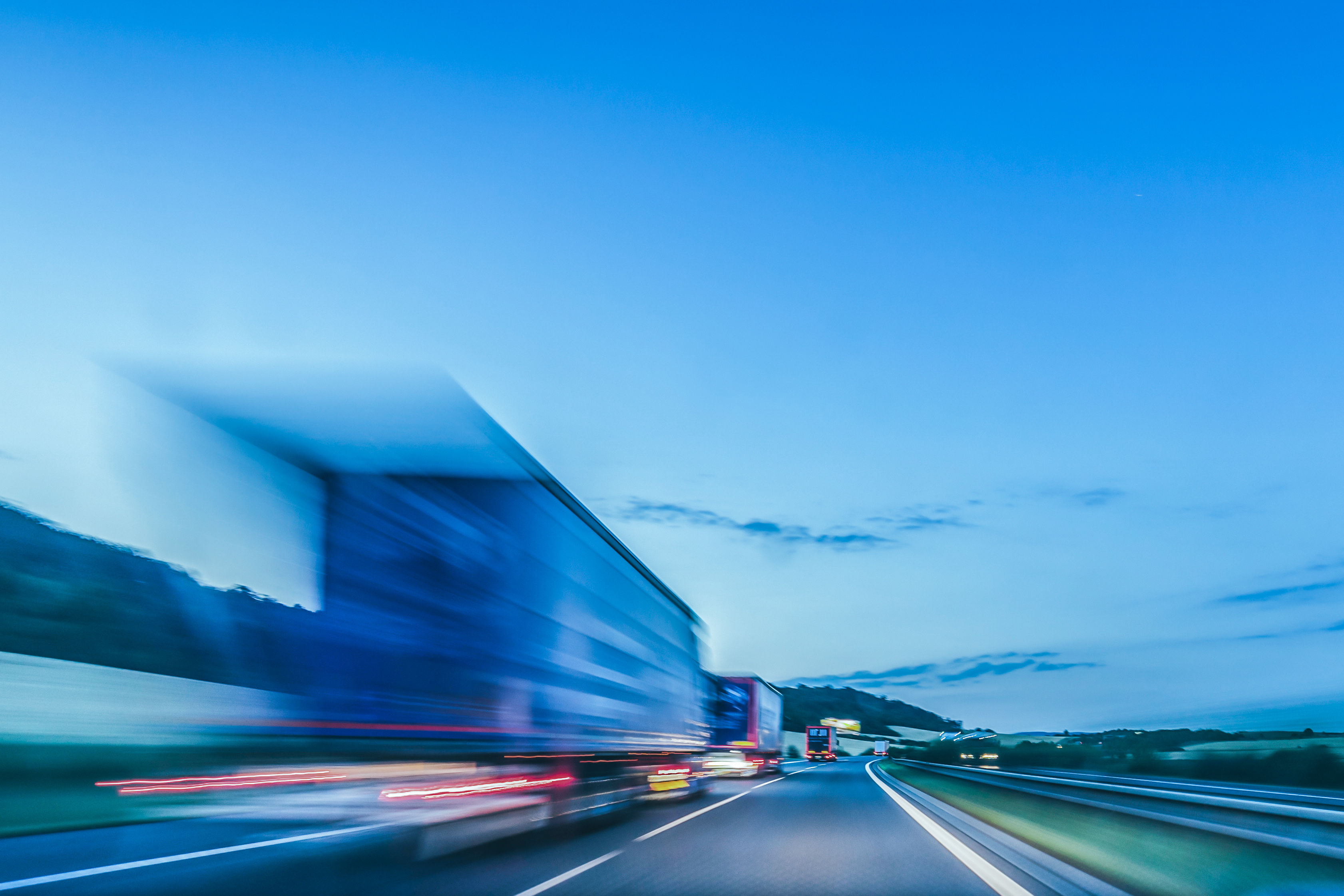 High-speed logistics truck driving on a highway, symbolising efficient distribution operations and supply chain performance