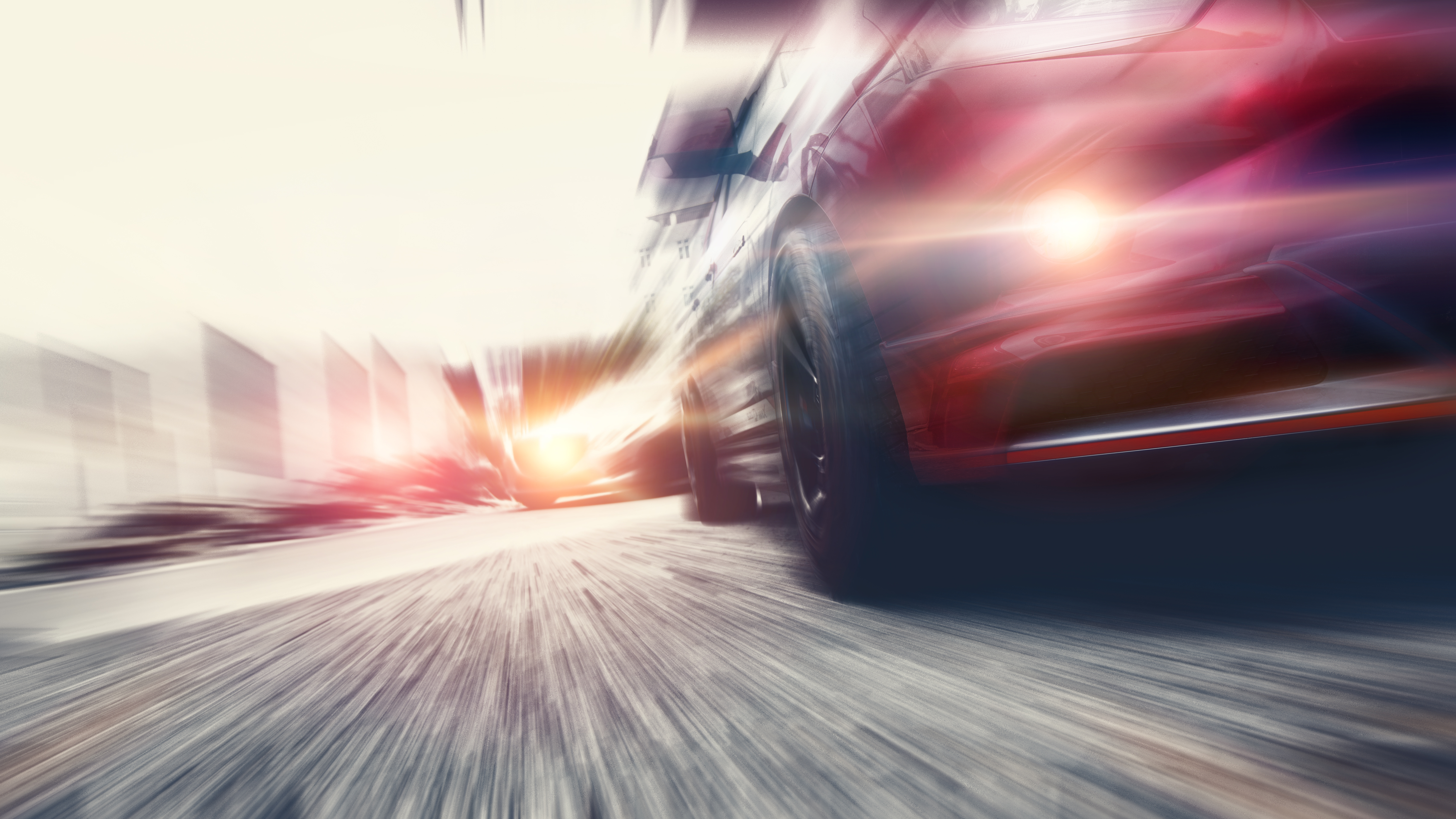 Fast-moving vehicle on the road, symbolising cyber-resilient automotive systems and secure vehicle operations