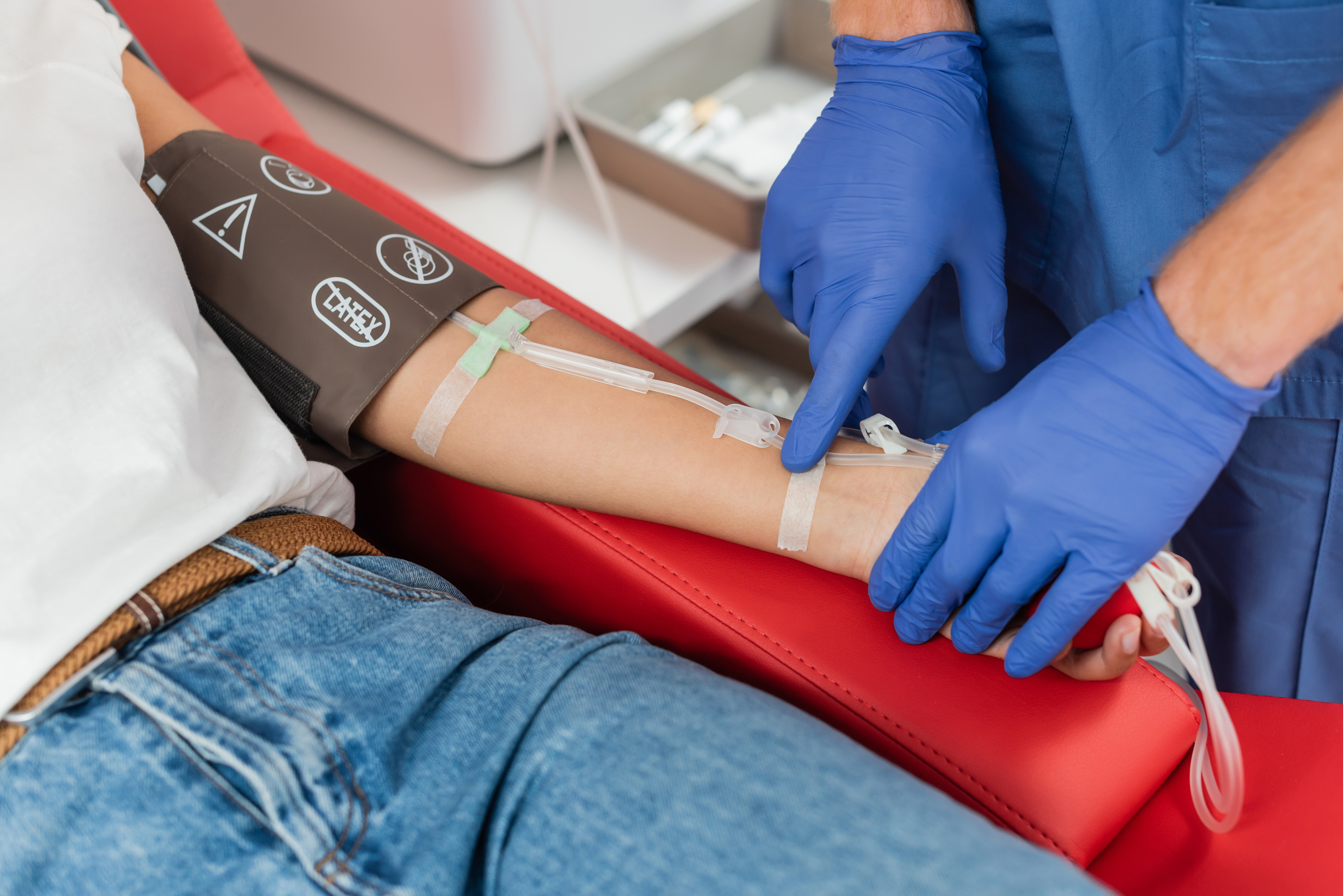Healthcare professional performing a blood draw on a patient, illustrating medical device safety, regulated procedures, and MDR/IVDR compliance.
