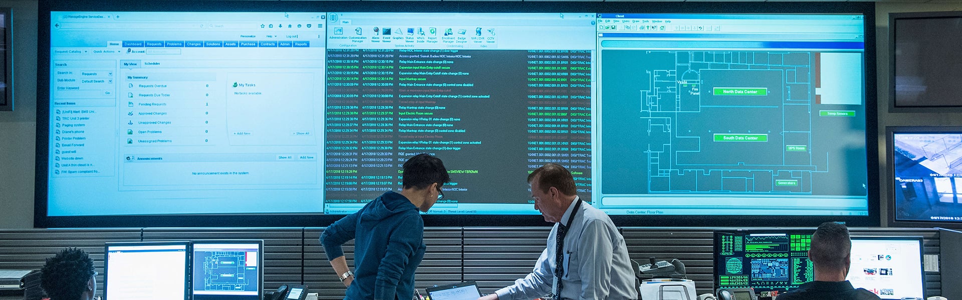 Colleagues working together in a server control room