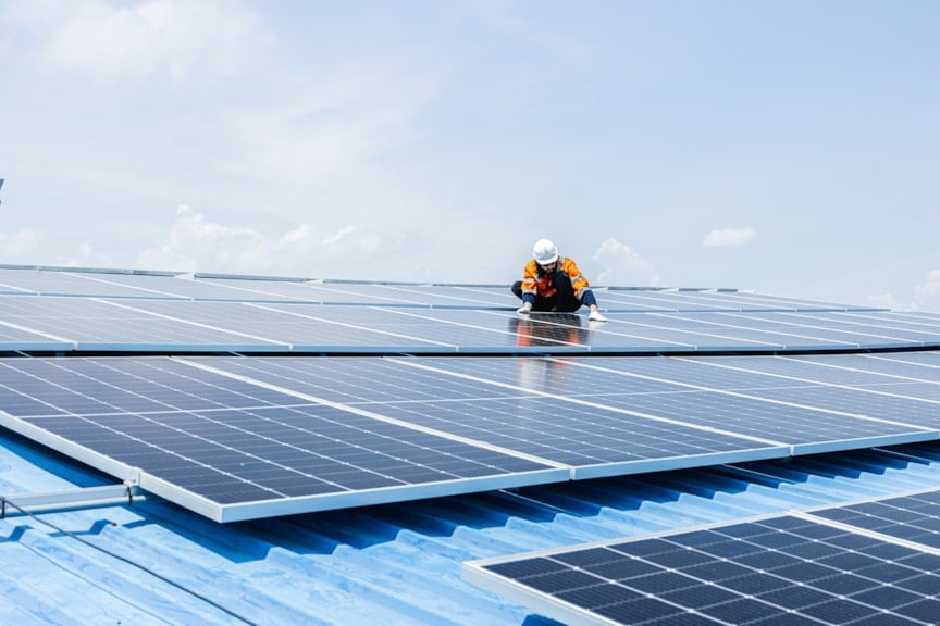 Surveyor inspecting solar panels