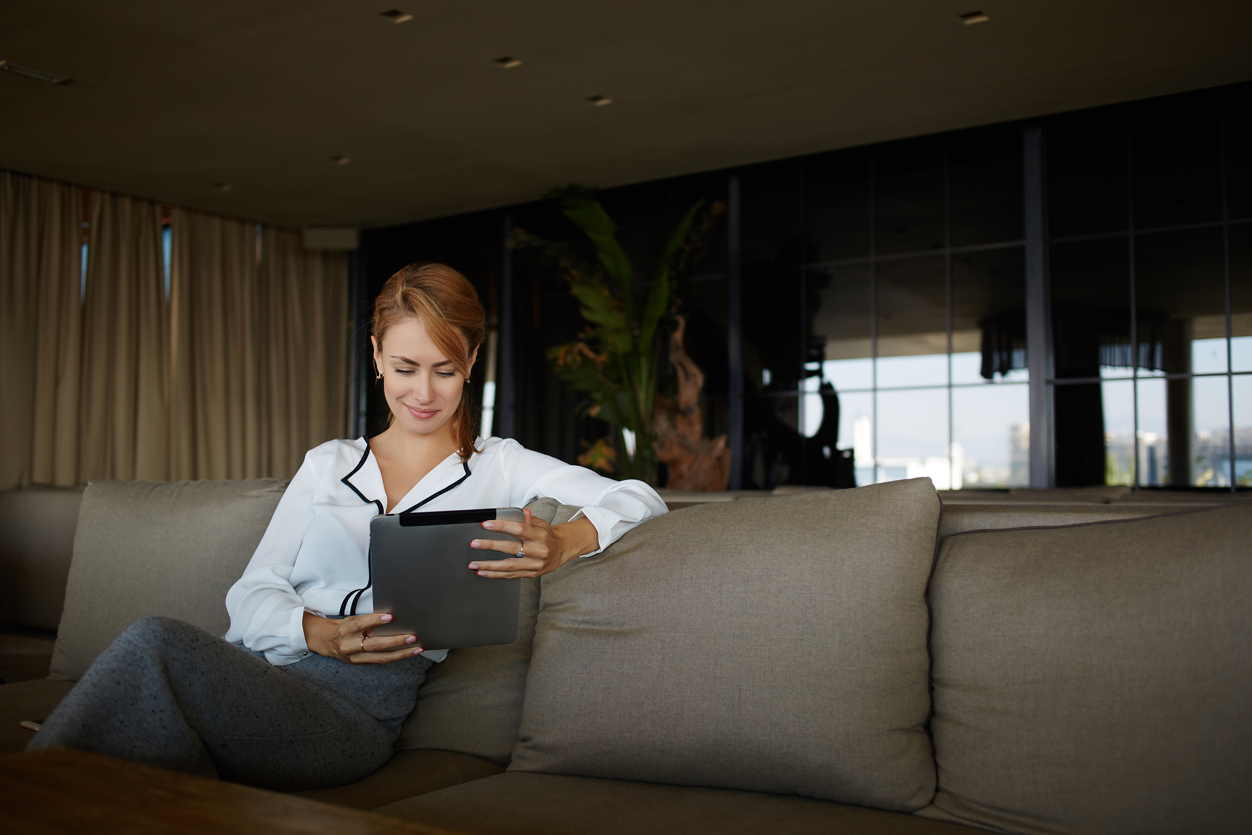 Business woman looking at tablet