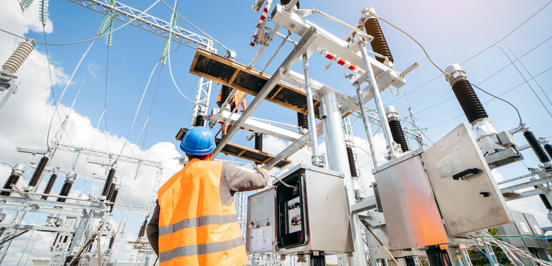 Electrical engineer inspect the electrical systems at the equipment control cabinet