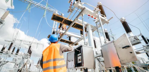 Electrical engineer inspect the electrical systems at the equipment control cabinet