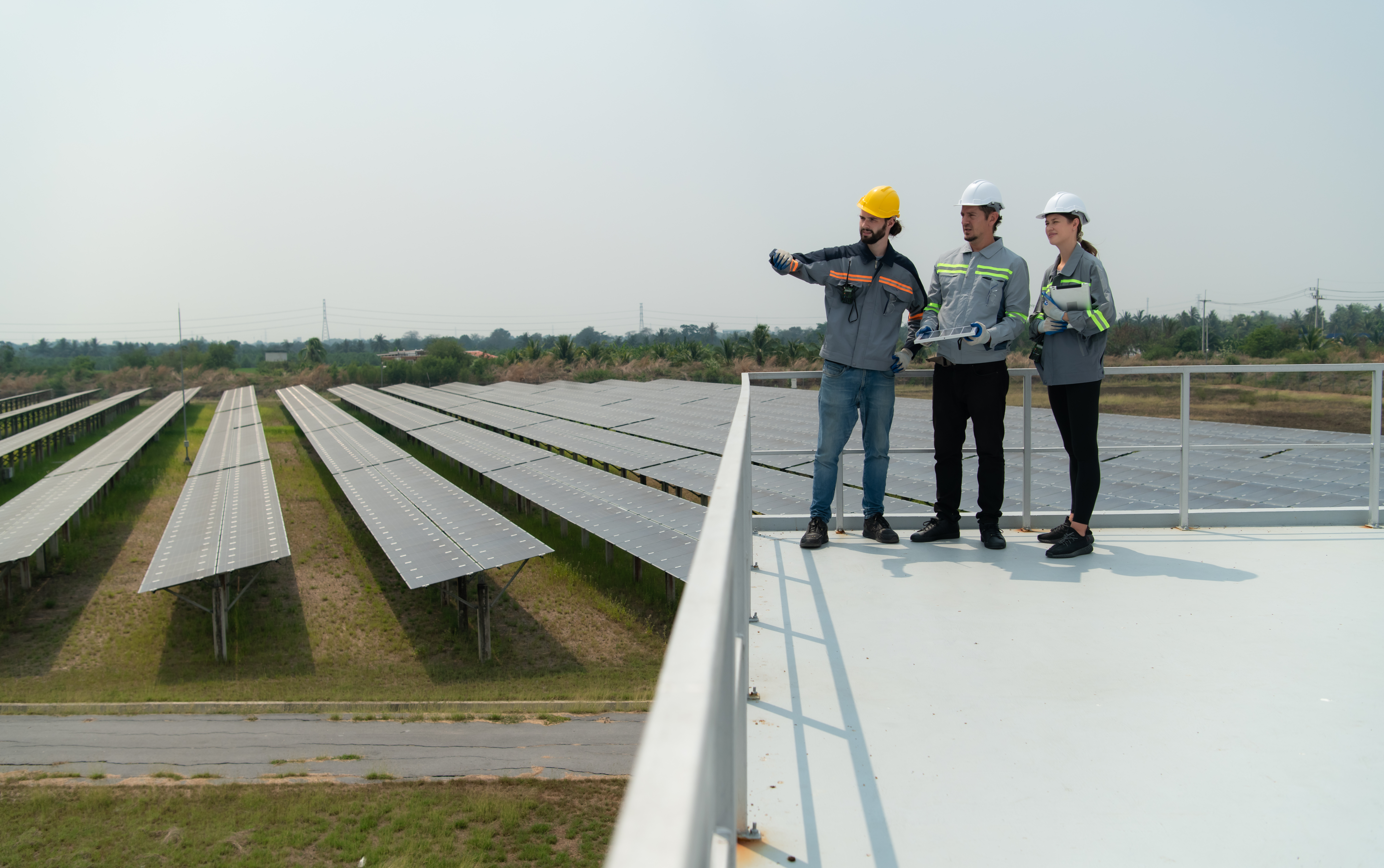 Technical team evaluating a large-scale energy storage site, illustrating field-level battery assurance and compliance checks