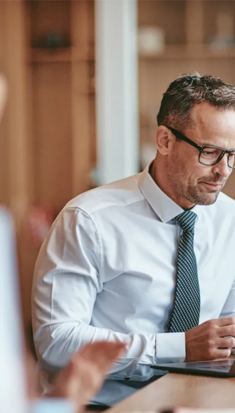 workers discuss business and strategy risk