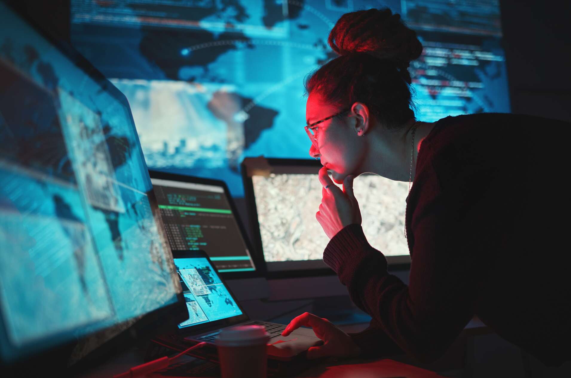 Maps, digital database and IT worker in dark room for virtual malware hacking fix of a employee back