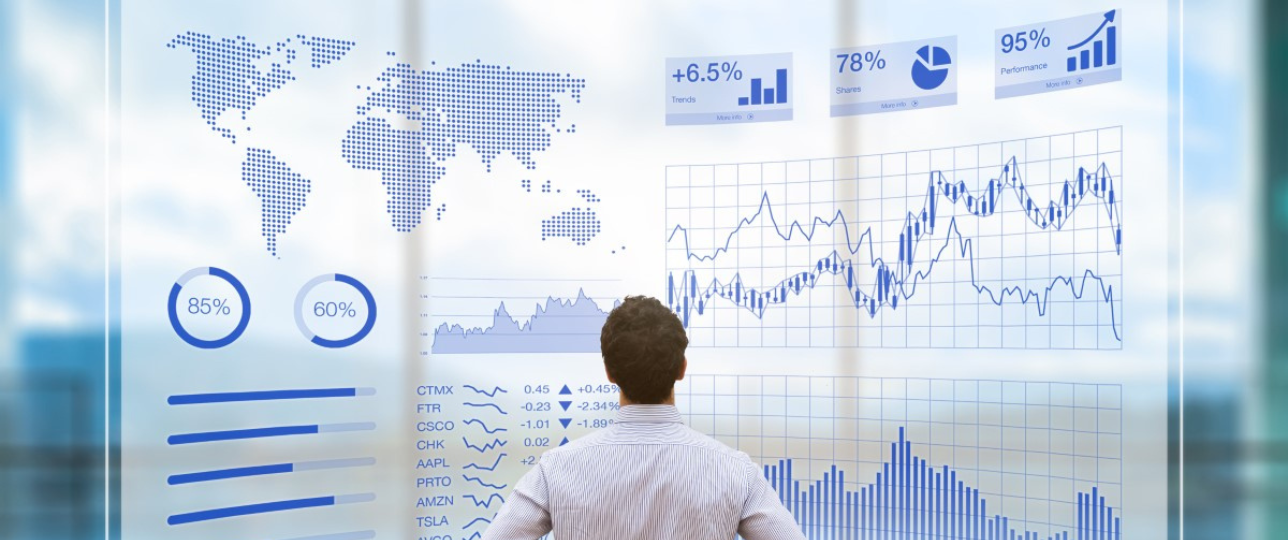 Man looking at the analysis on large screen