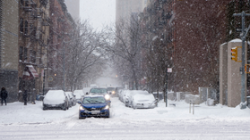 snowed houses with poorer house on the hill