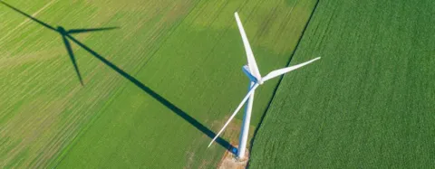 Wind turbine and countryside corn field