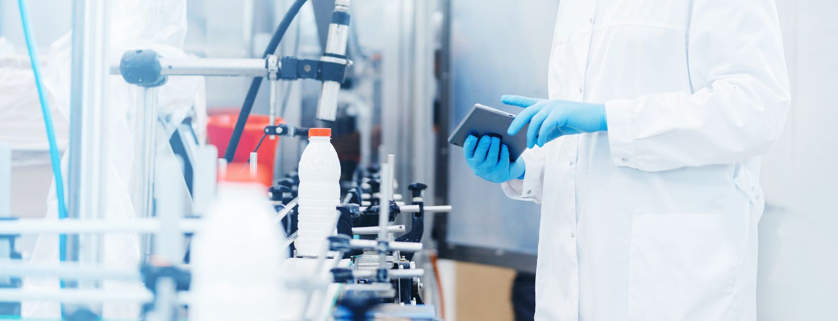 Worker inspecting production line