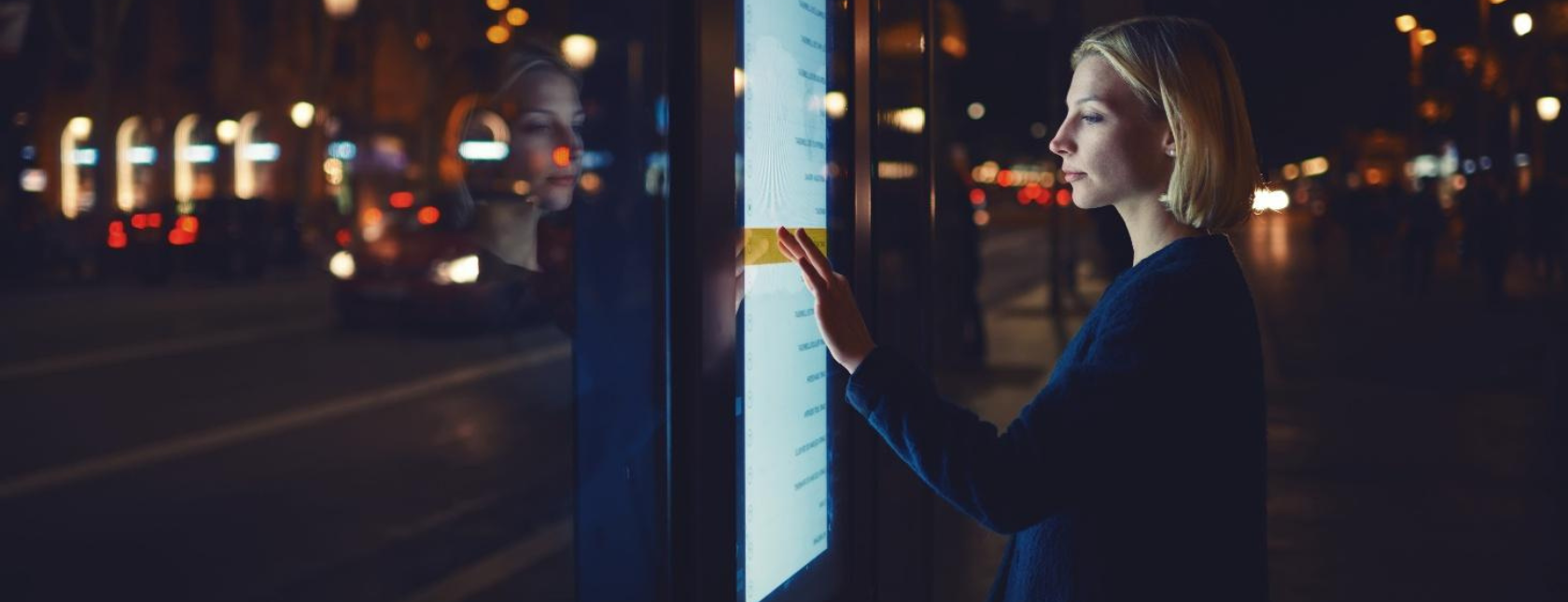 Young woman touching sensitive screen
