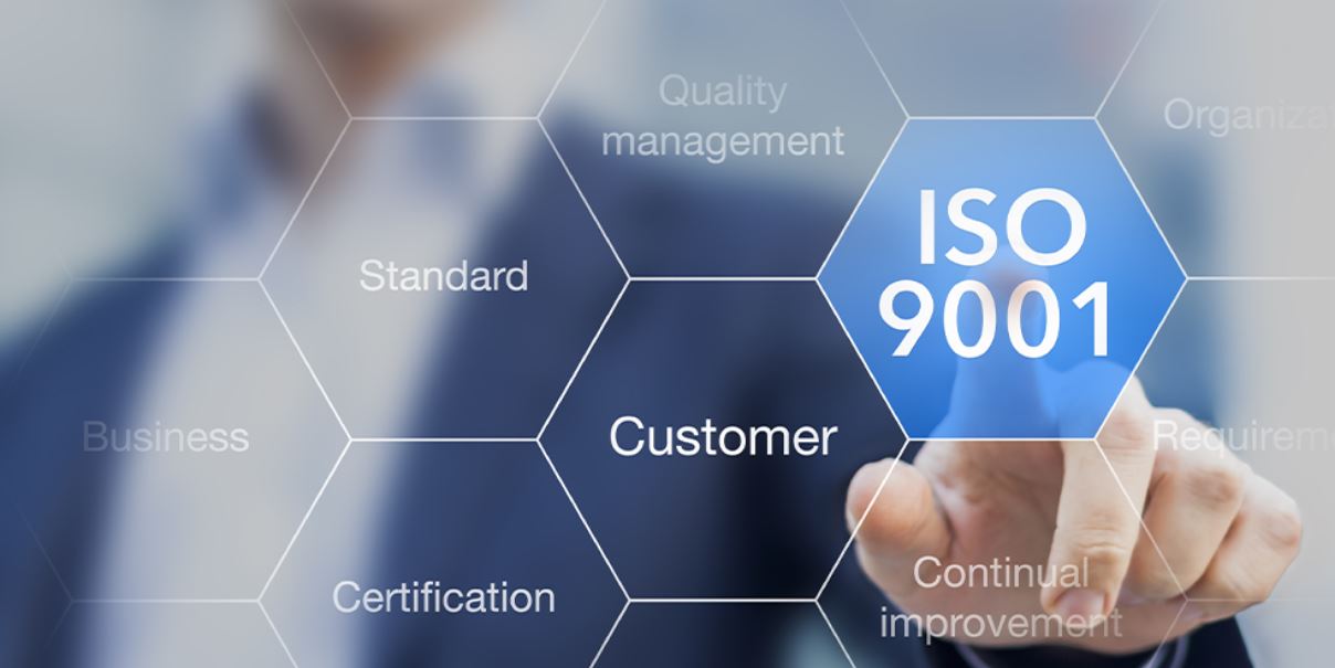 man pointing at ISO 9001