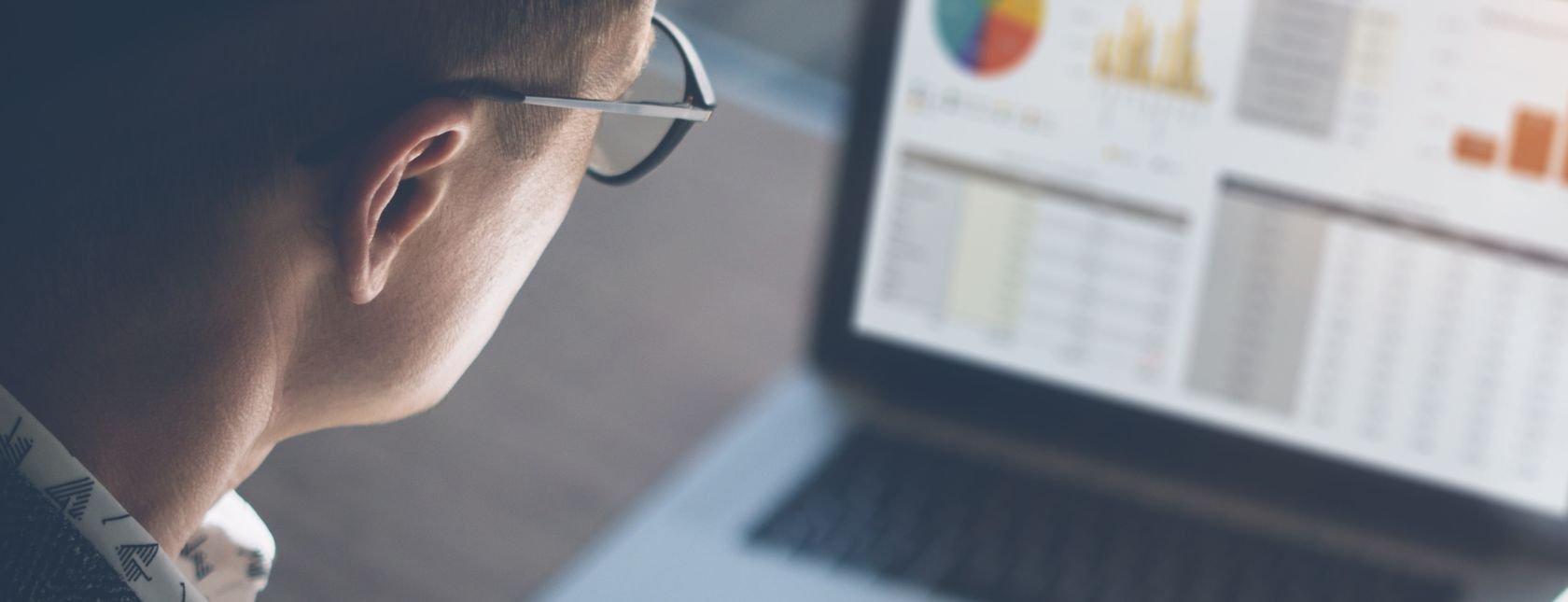 Young man analyzes data