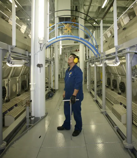 Mechanic inside engine room
