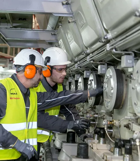 MAN employees working on engine