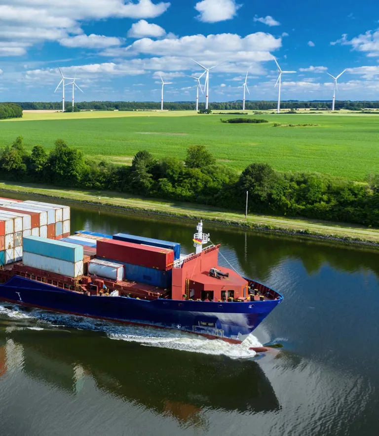 Containership_passing_wind_turbines.jpg