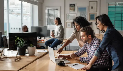 colleagues discuss audit management software