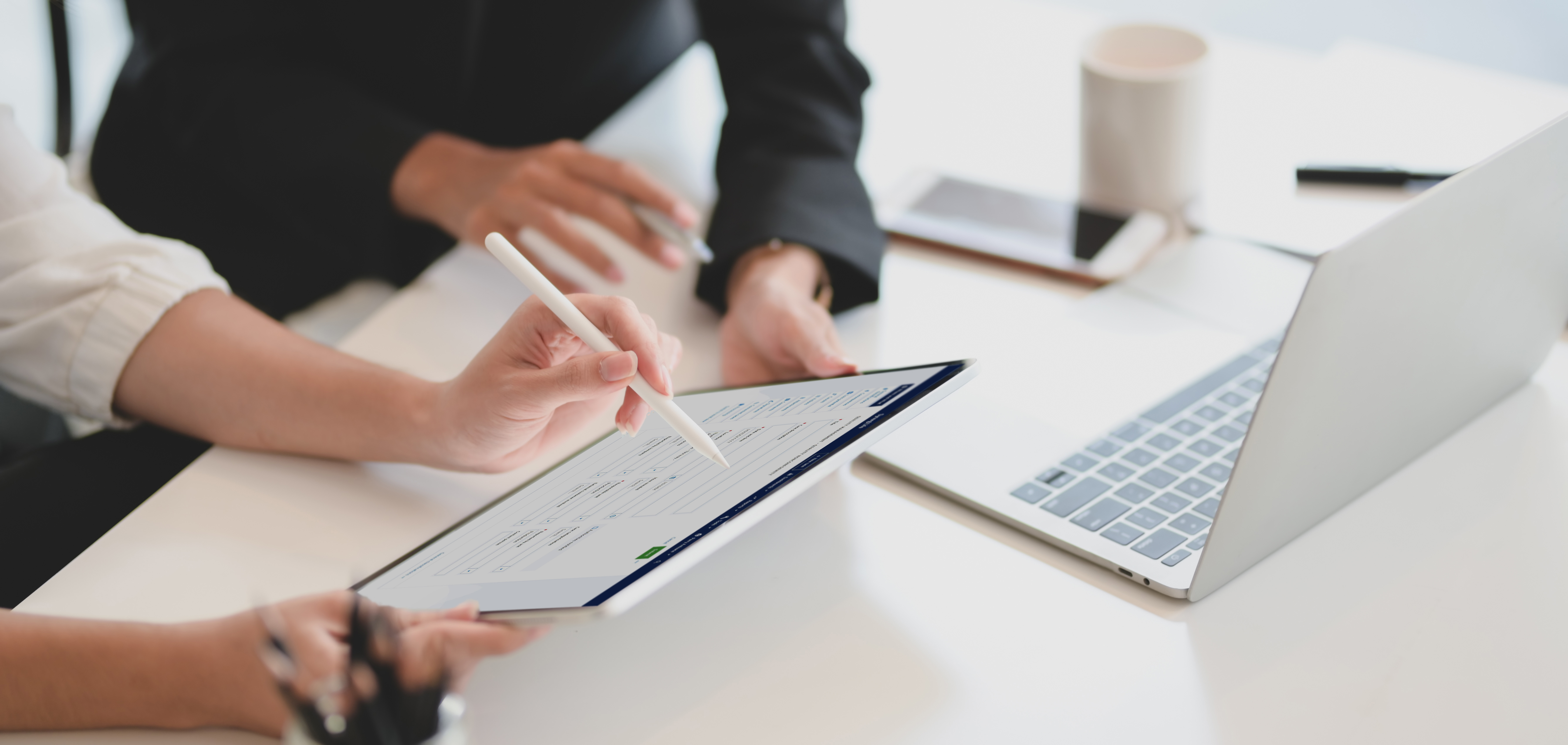 colleague use quality management software on tablets