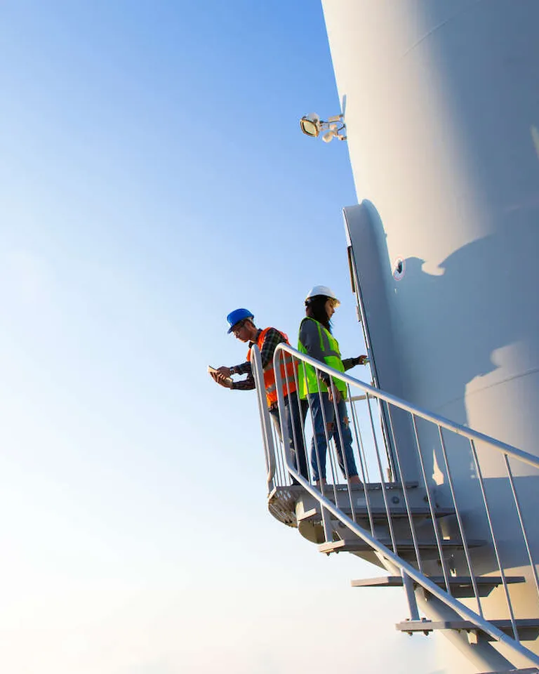 Maintenance engineers working on wind turbines
