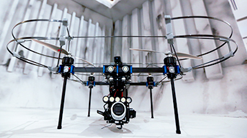 DNV GL surveyor simulating the use of a drone in a cargo hold.