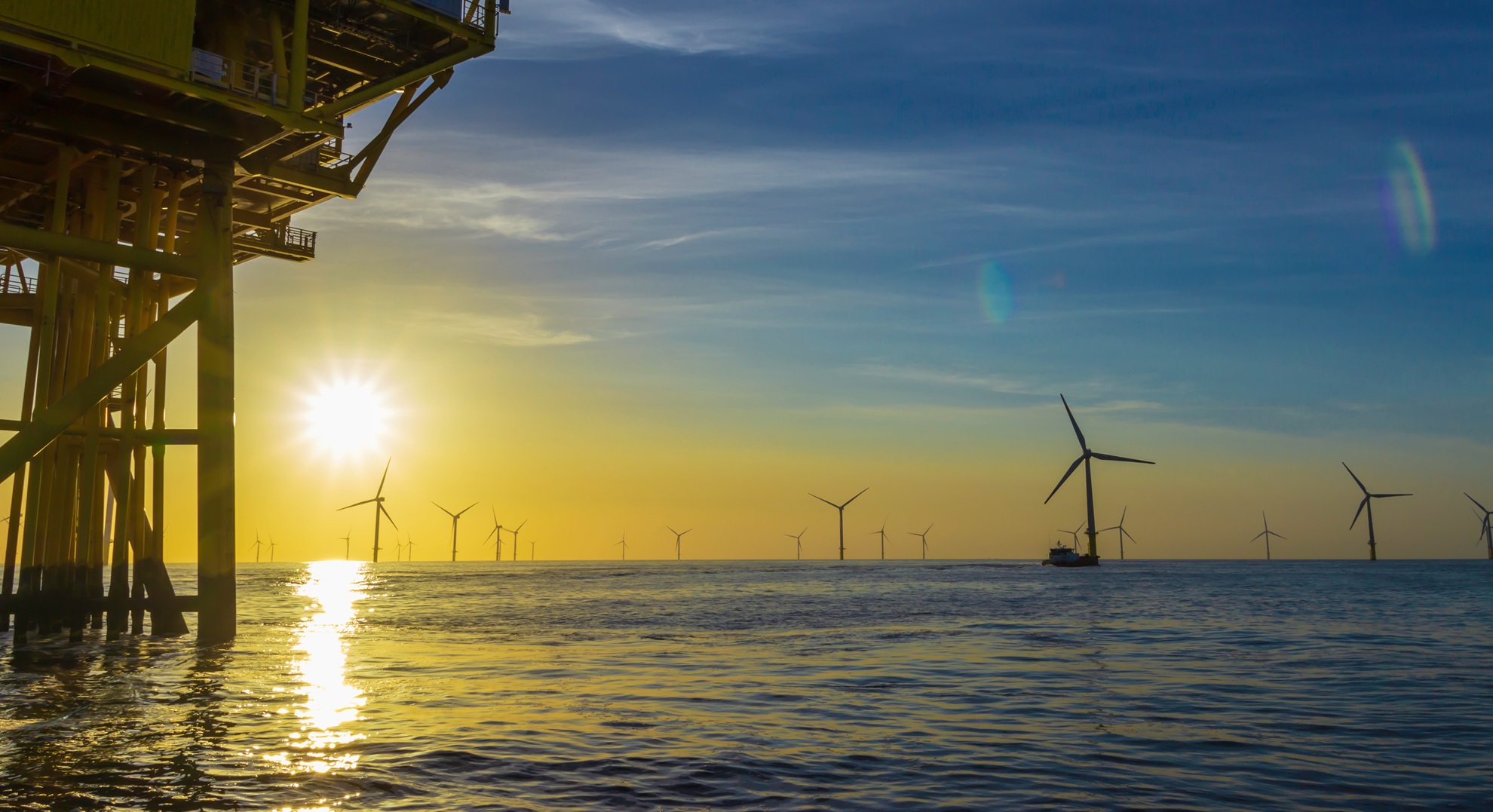 Sunset over a North Sea offshore wind farm