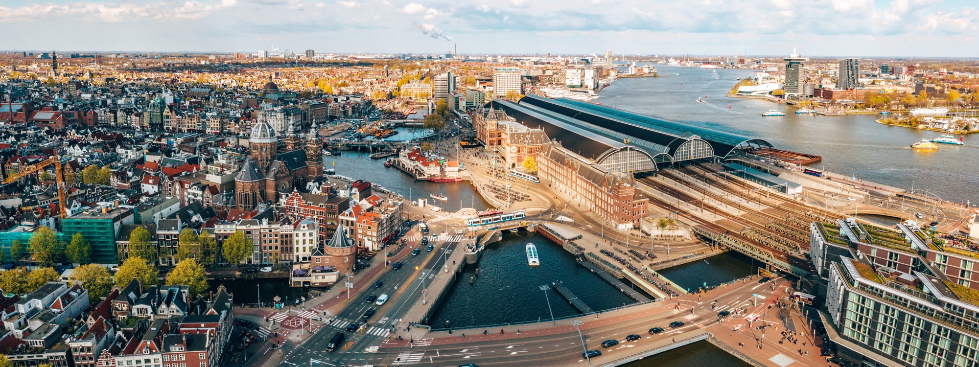 Amsterdam skyline with canals and central train station