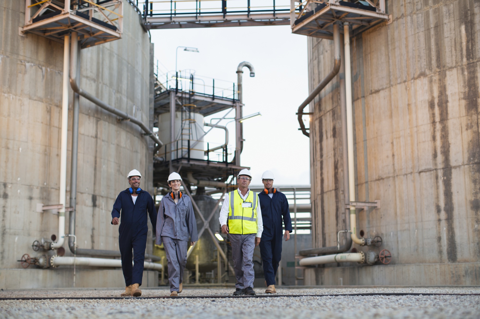 Workers walking at a chemical plant