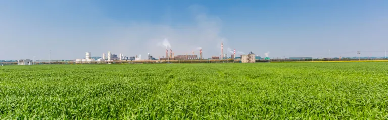 Industrial zone - surrounded by green gras and blue sky