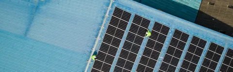Energy Transition Outlook 2025 - Aerial top view of engineer worker installing solar photovoltaic panels
