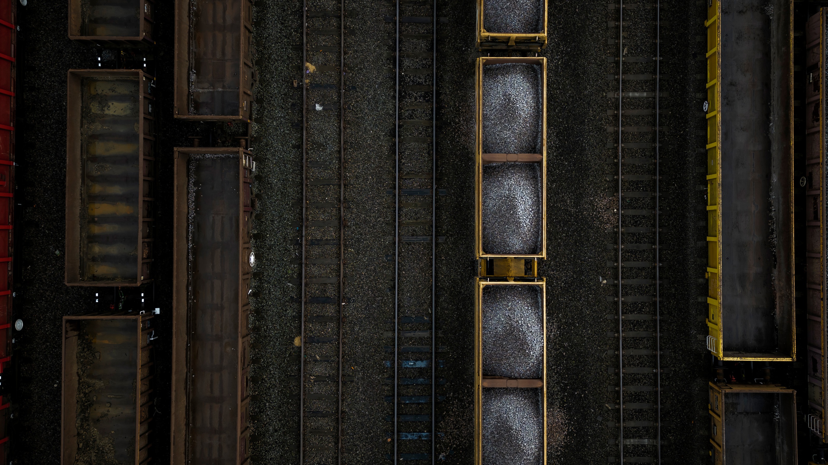 Modern rail infrastructure and trains viewed from above, illustrating regulatory compliance in the railway sector