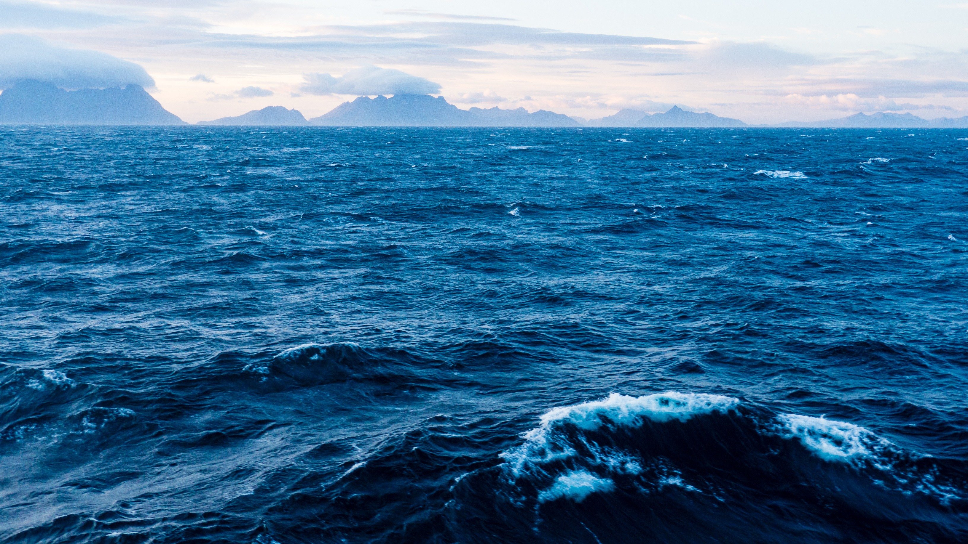 Coastal aquaculture location with ocean currents representing site selection, feasibility assessment, and environmental compliance