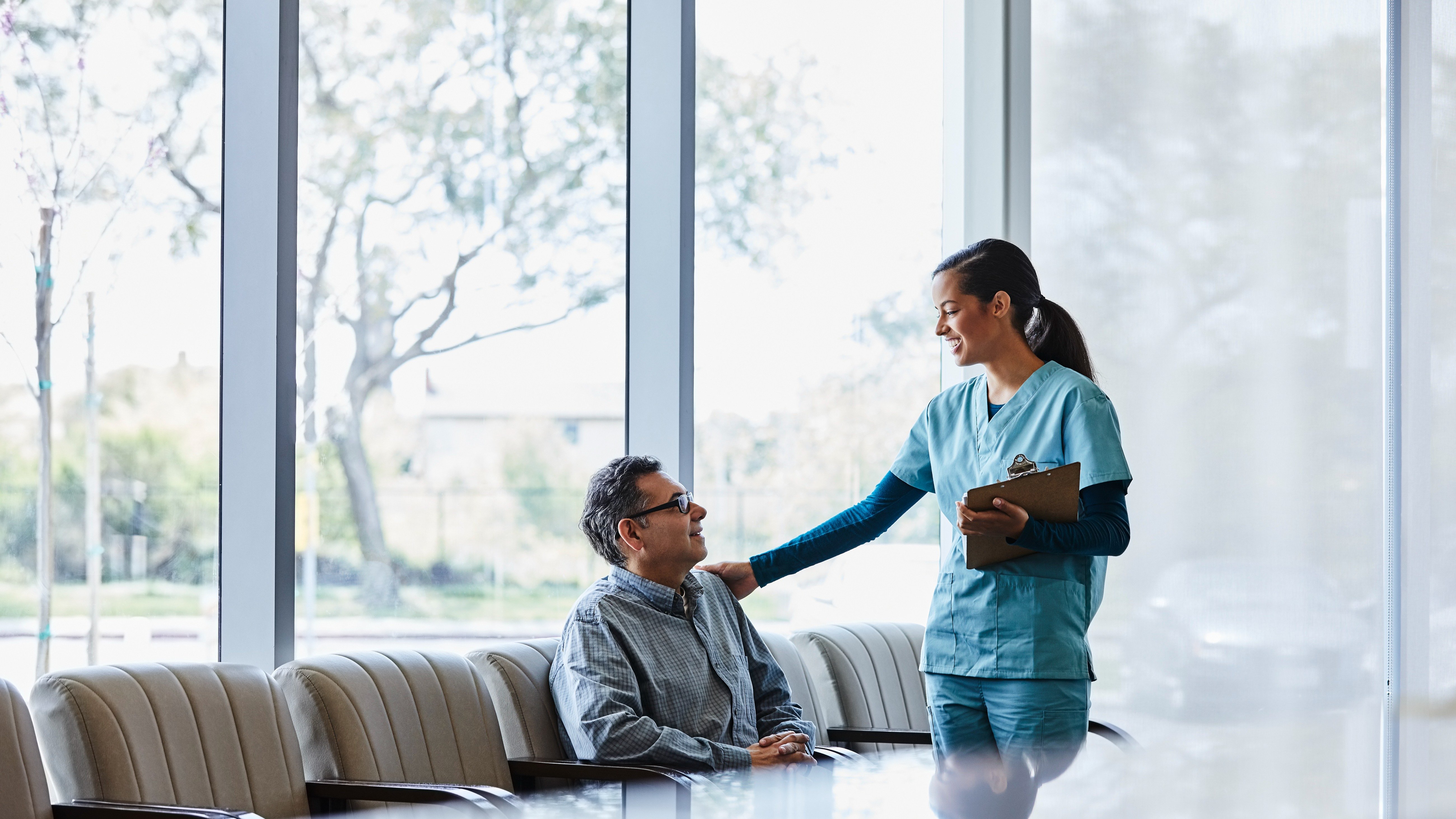 Ambulance vehicle outside a healthcare facility, symbolizing safety, readiness, and quality in ambulatory surgical care.