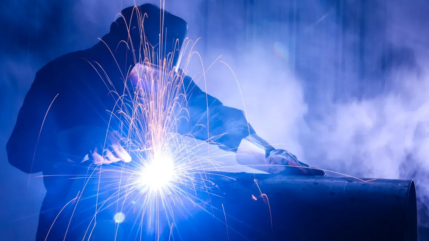 Welder performing arc welding, illustrating material certification requirements for EN 13479 welding consumables