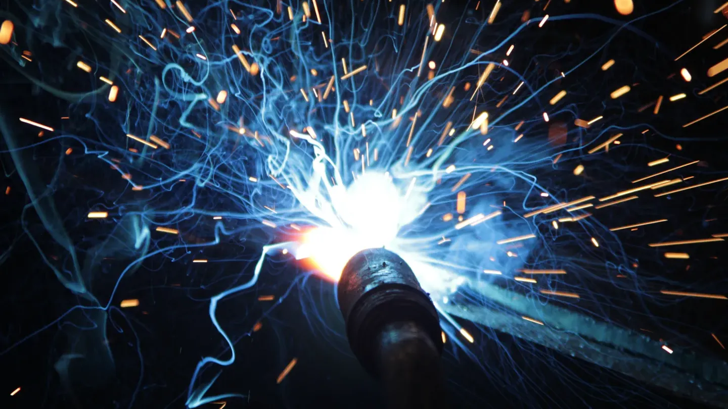 Close-up of welding arc and sparks, representing skills certification for welders and operators across manual, semi-automatic, and mechanized processes