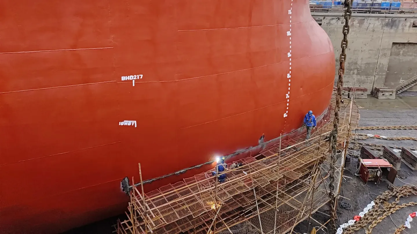 Welding inspection on a large vessel hull, representing ISO 3834 fabrication quality assurance and certified welding controls