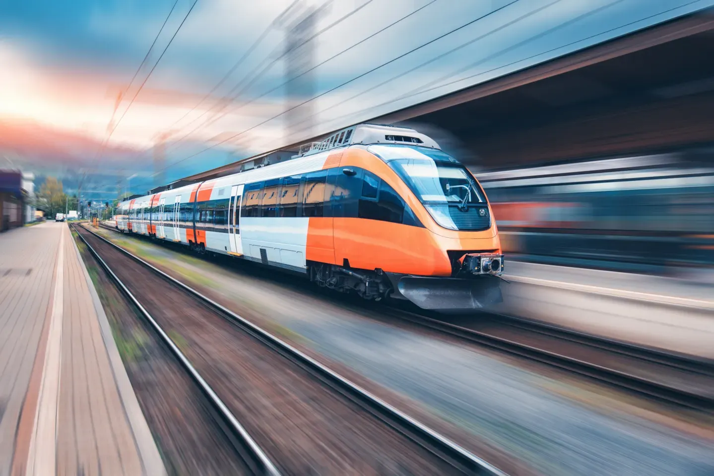 High-speed train moving through a modern rail network, representing secure digital development and cyber-resilient rail operations