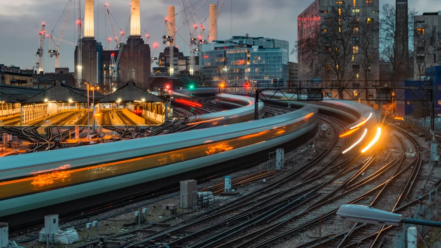 Urban rail system with trains moving through a modern cityscape, symbolising compliant, safe, and accredited railway operations