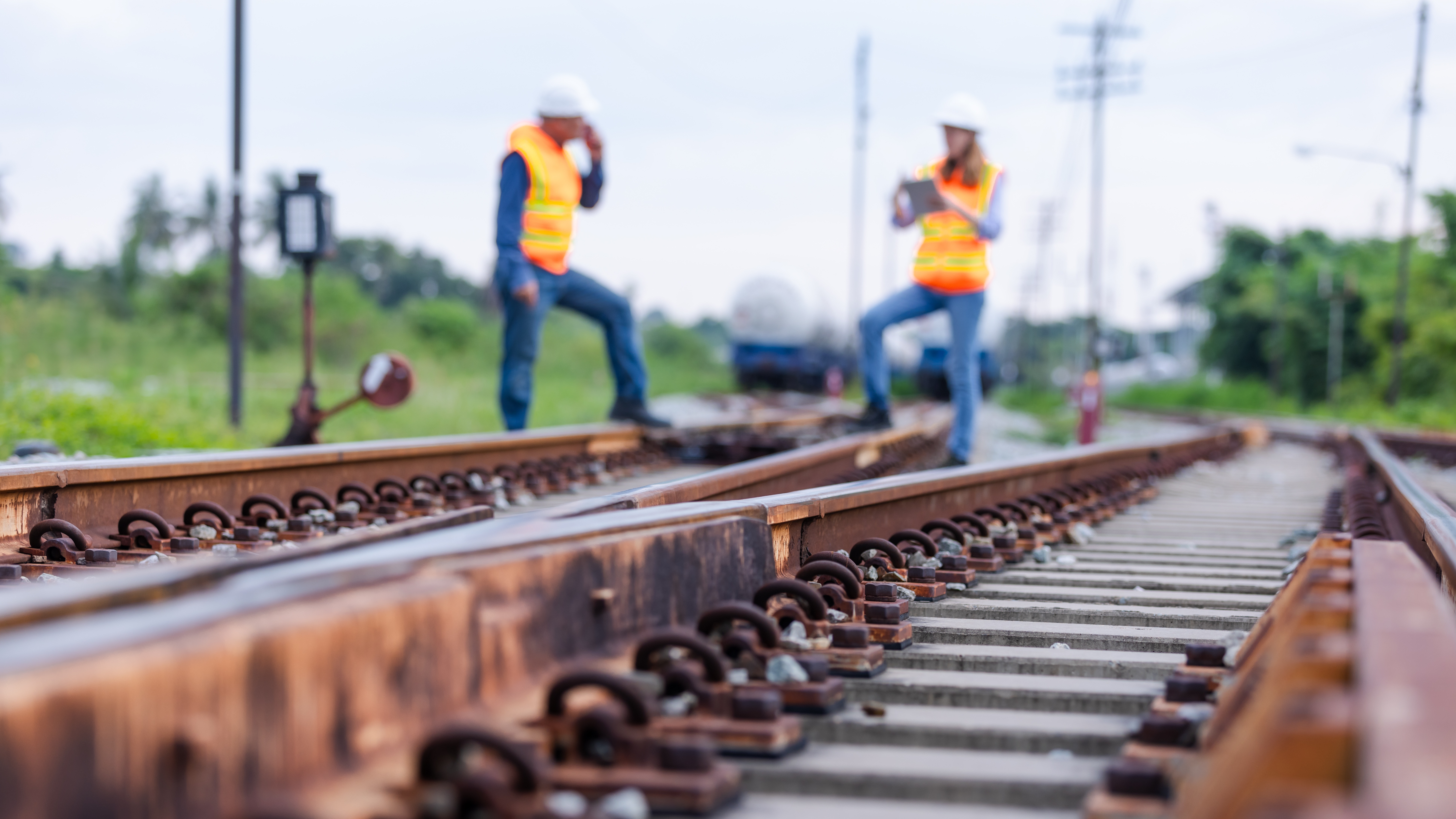 A railway expert inspecting tracks and infrastructure for accredited certification compliance