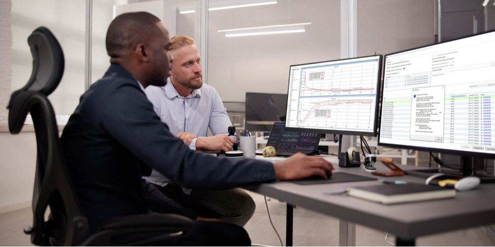 two workers use sps model lab software