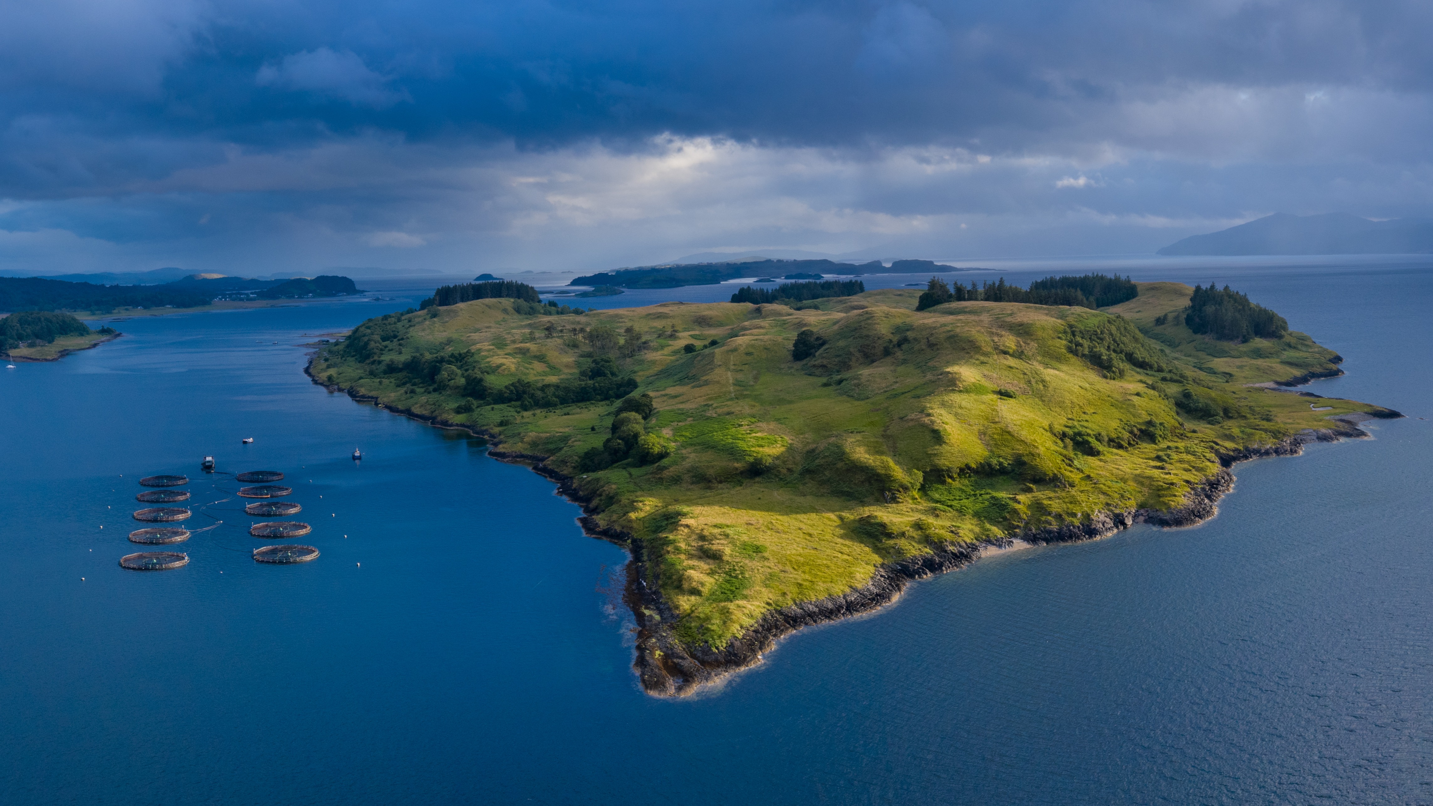 Aerial view of aquaculture installations near a coastal island