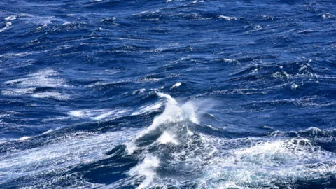 Ocean waves representing marine dynamics and offshore aquaculture conditions