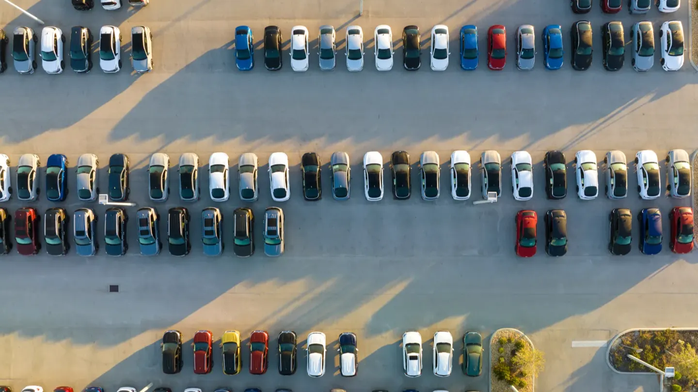Aerial top-down view of vehicles on a multi-lane road, illustrating system-level safety performance and reliability evaluation
