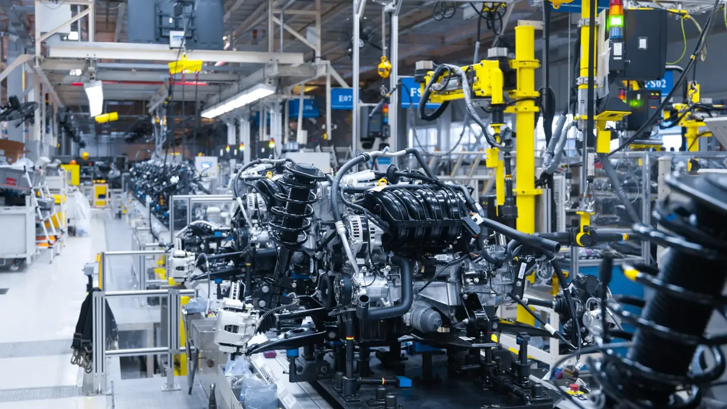 Automotive manufacturing line with robotic systems and machinery, symbolising design validation and early-stage safety assurance