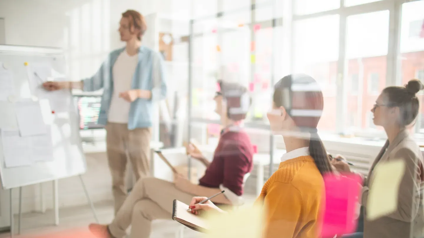 Automotive teams participating in an ASPICE training workshop with instructors and collaborative exercises