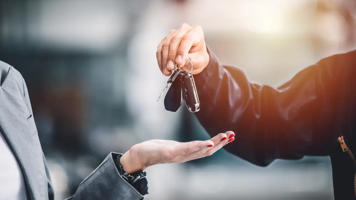 Engineer using a tablet to review vehicle data, illustrating traceability checks and validation of functional safety requirements
