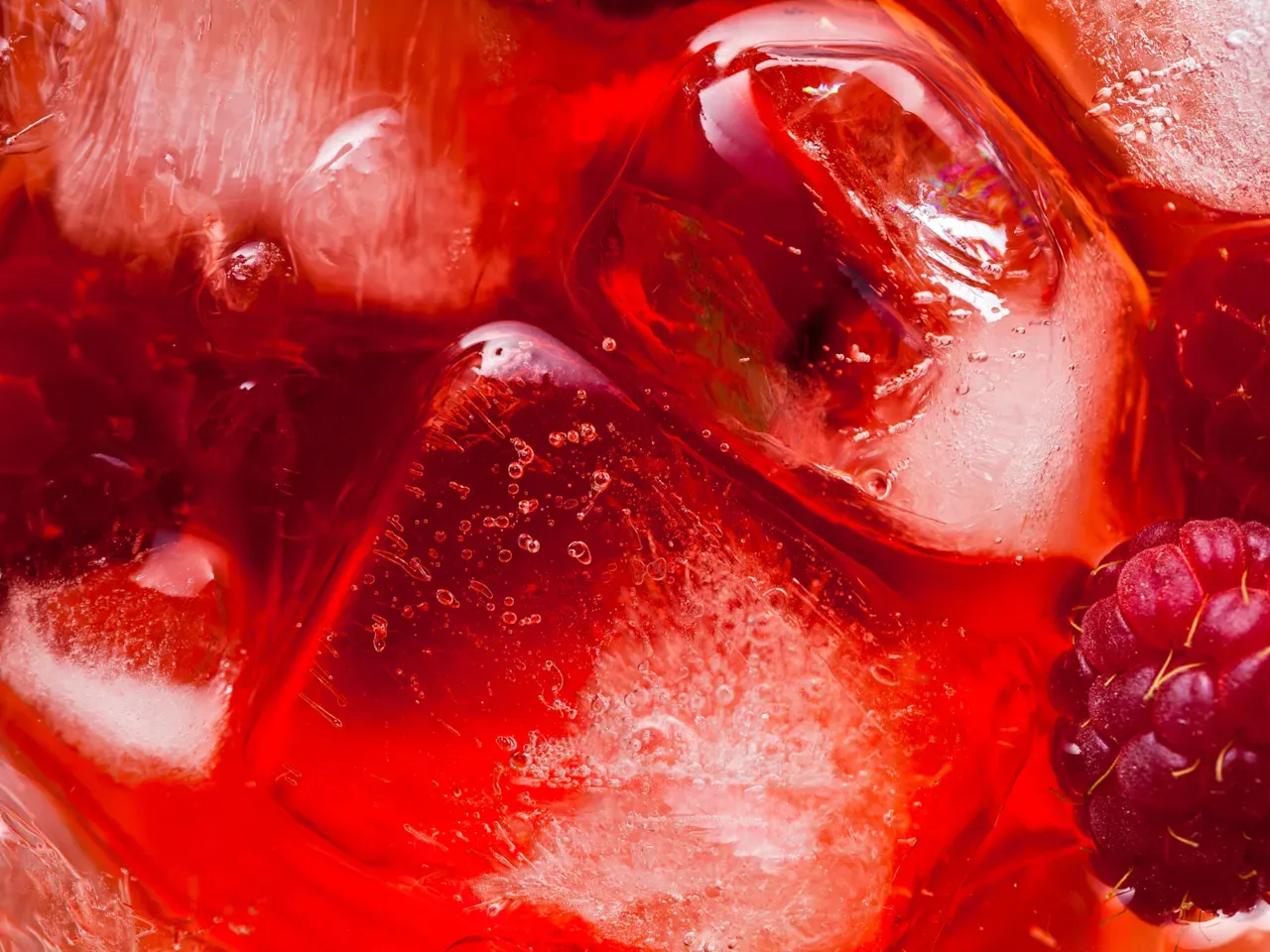 Close-up of red berries and fruit mixture, representing food sector sustainability and natural ingredient sourcing