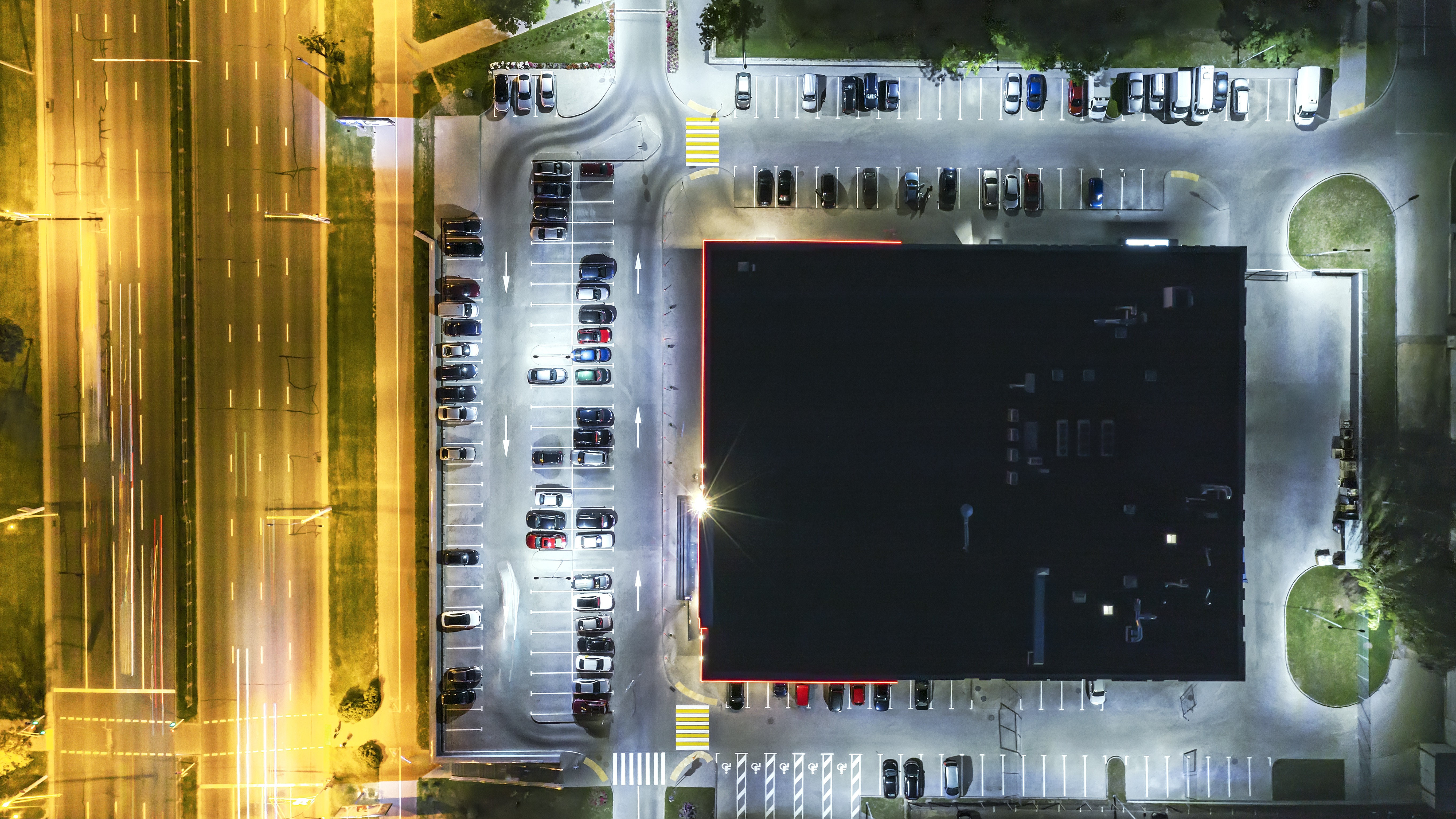 Aerial night view of retail facility symbolizing supplier audits, transparency, and compliance verification