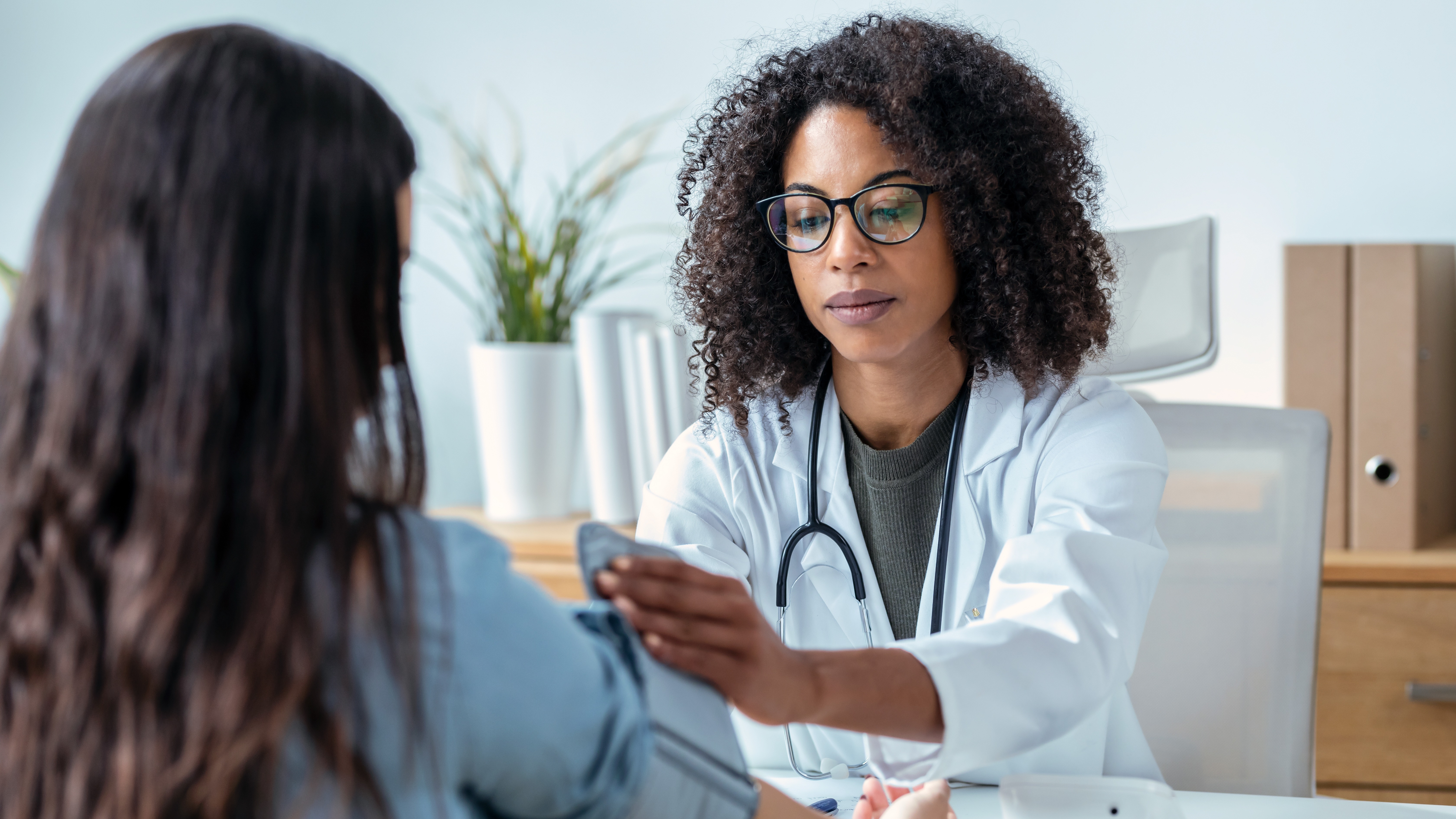 A cardiologist consulting a patient in a bright, professional clinic - symbolizing trust, expertise, and commitment to cardiovascular excellence.